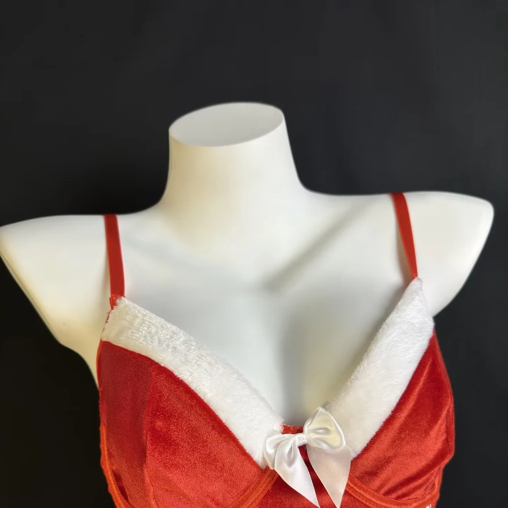 Red velvet Christmas lingerie top with white trim, bow and side lace-up detail